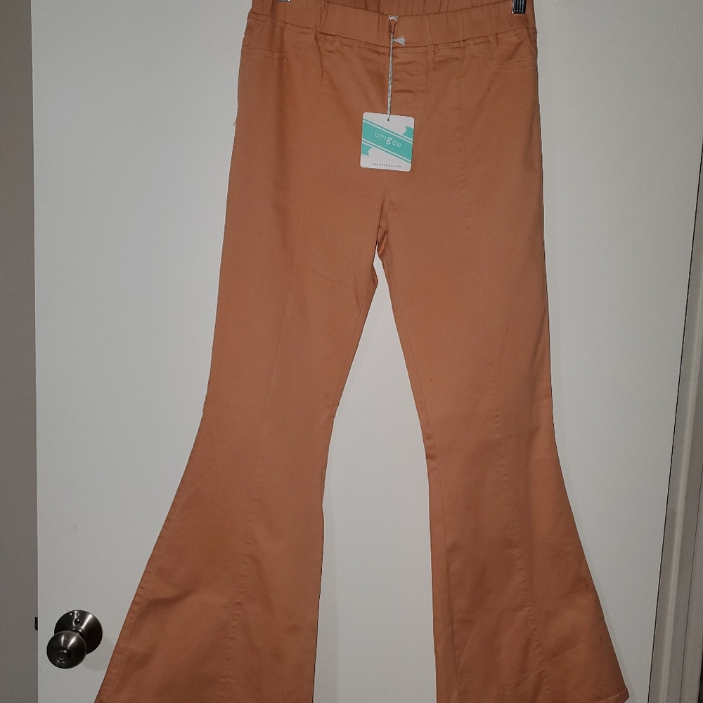 Flared pull on stretch pants.